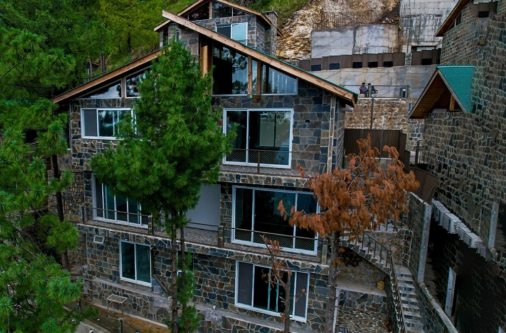 Vacation home in Murree-style stone villa surrounded by pine trees — Blue Pine Mountain Homes