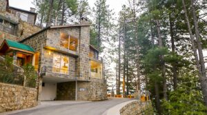 Passive income real estate Pakistan – Blue Pine villa in Galiyat at dusk