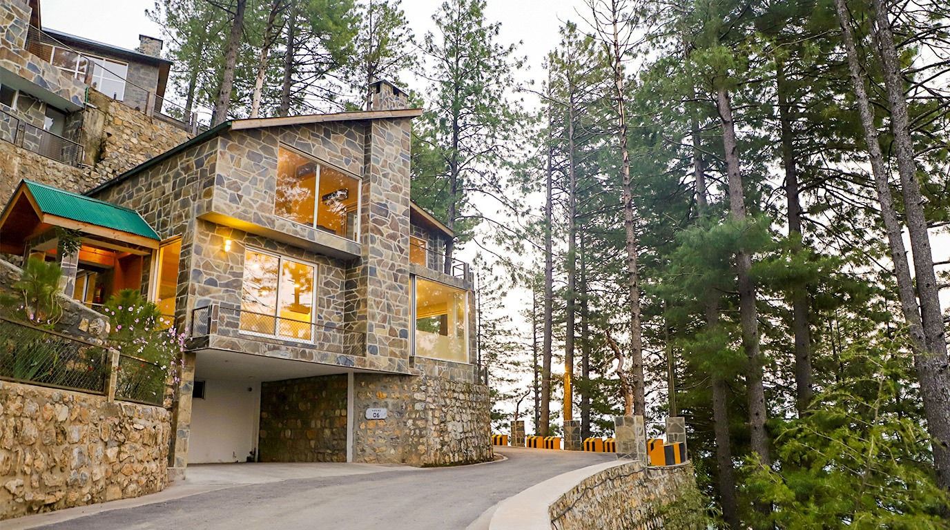 Passive income real estate Pakistan – Blue Pine villa in Galiyat at dusk