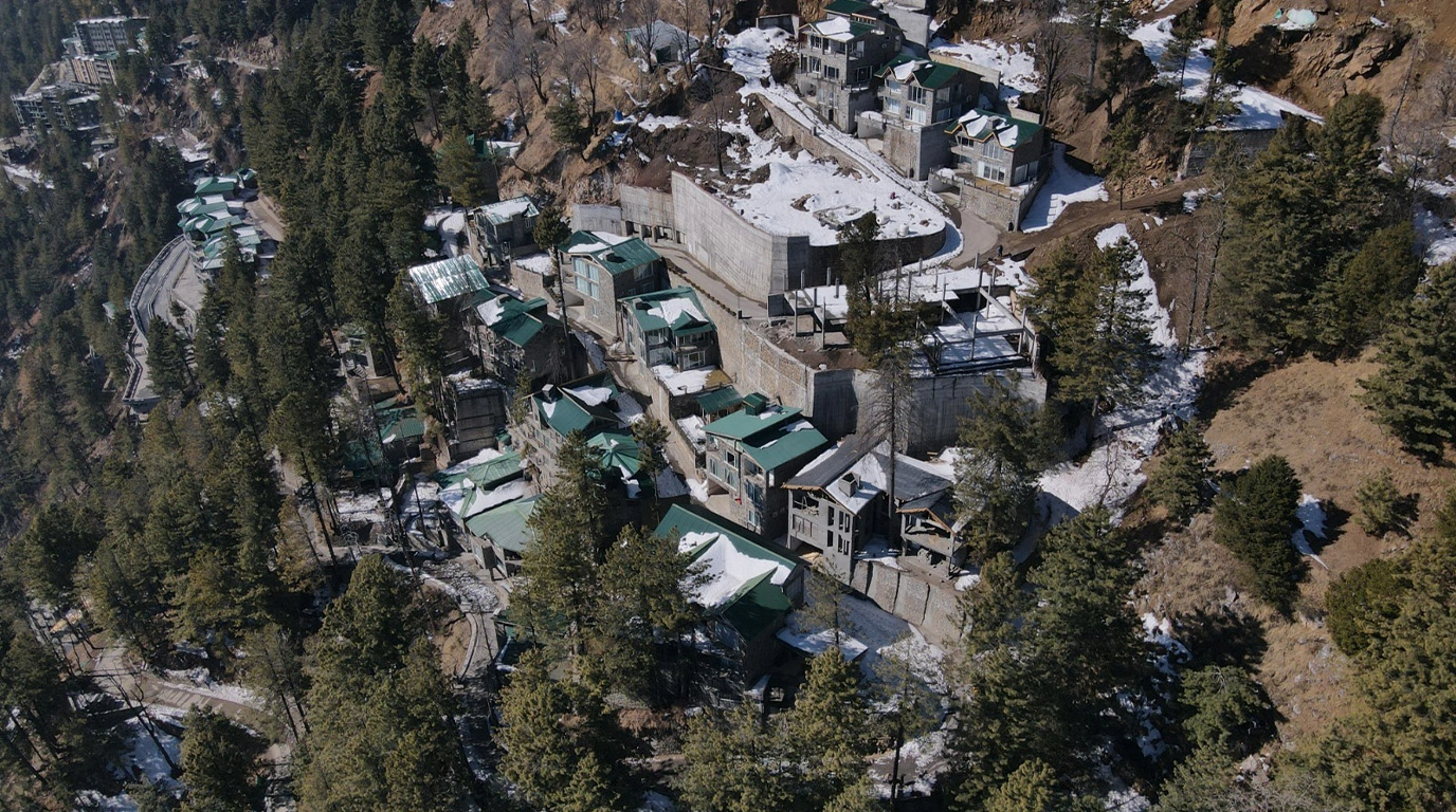 360 drone shot of Blue Pine Mountain Homes, showcasing luxury mountain homes Pakistan 2026 in Khaira Gali, Galiyat