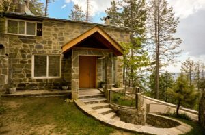 Investment property in Galiyat Pakistan – stone villa entrance Blue Pine Khaira Gali
